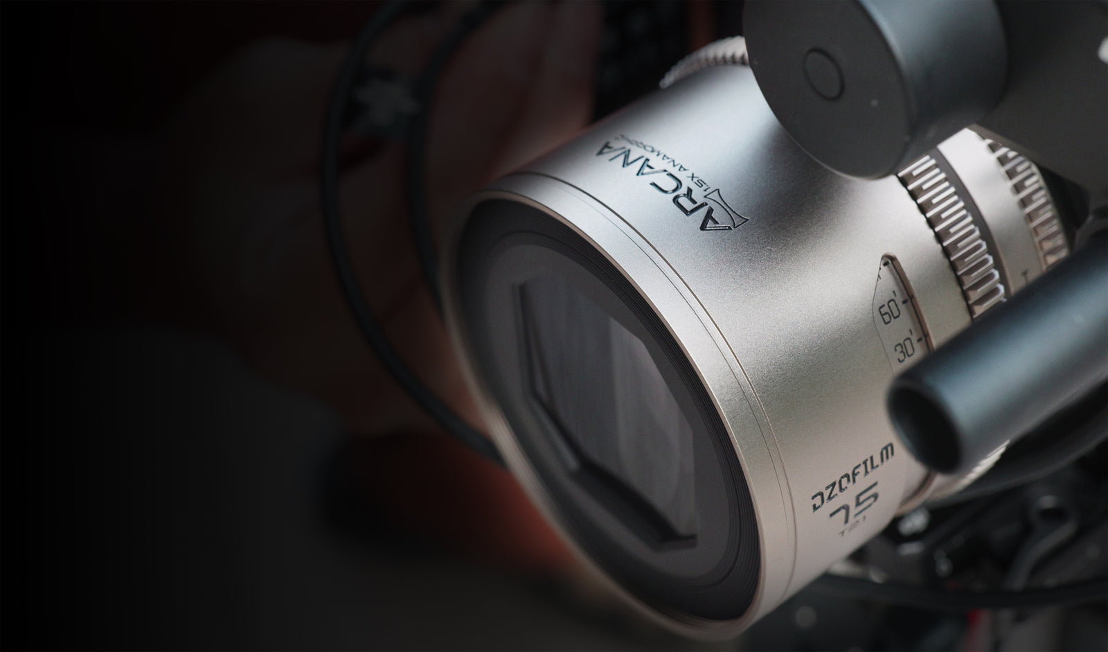 DZOFilm Arcana 75mm anamorphic lens close-up on a compact camera rig
